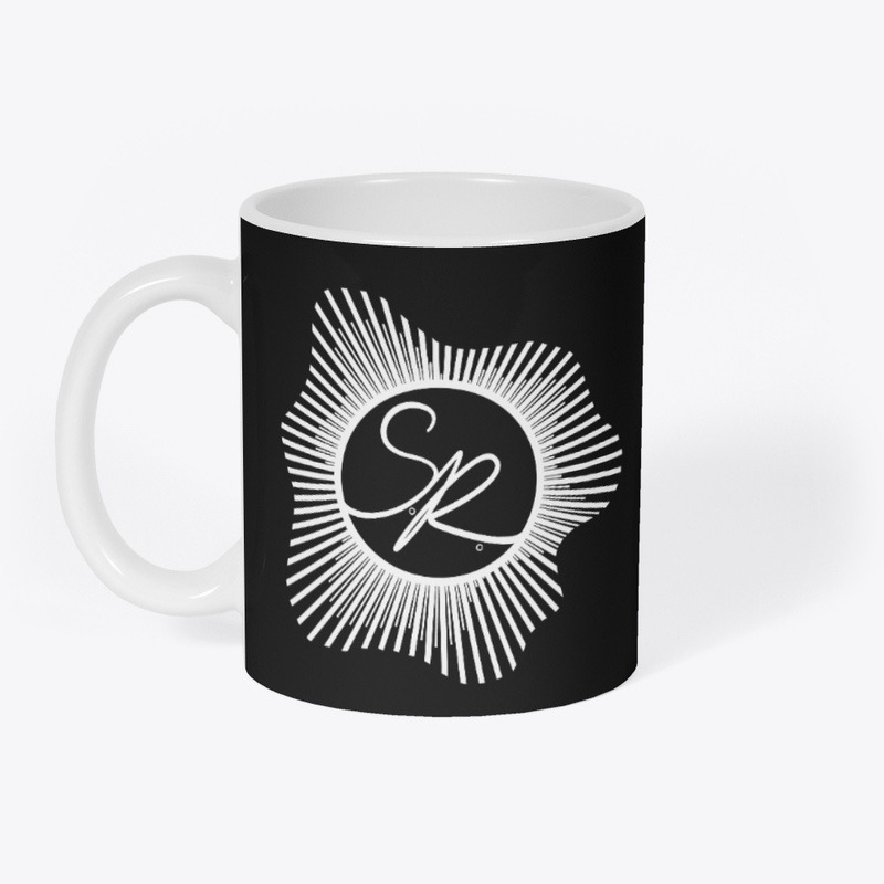 Black ceramic mug with a white interior and handle, printed with the SR sunburst logo